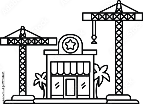A building with a star on it and two cranes in the background