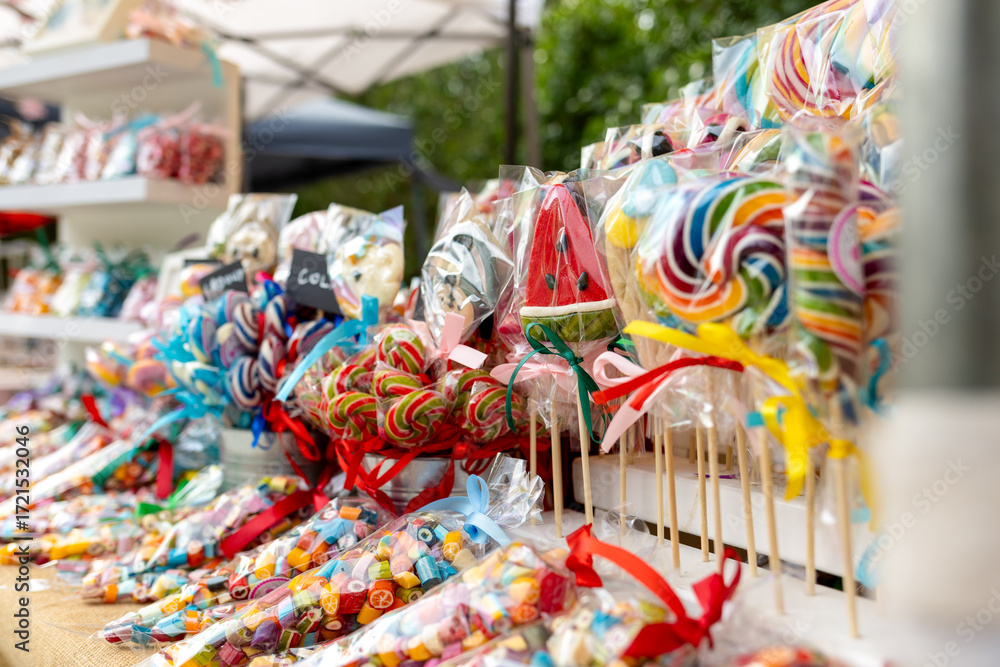 Fototapeta premium a counter with brightly colored lollipops, sweets for children
