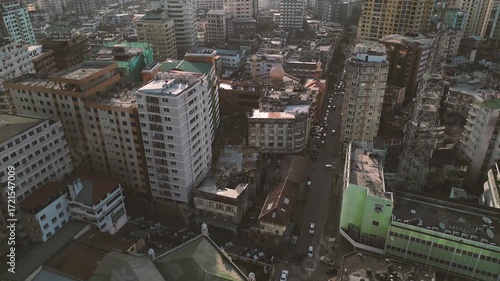 Drone Aerial of Dar es Salaam City Skyline with Old Buildings under Cloudy Sky in Tanzania