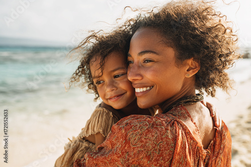 Black Woman Carrying Child on the Beach, Smiling Together