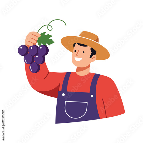 Smiling male farmer in a straw hat and blue overalls holding a fresh bunch of purple grapes.