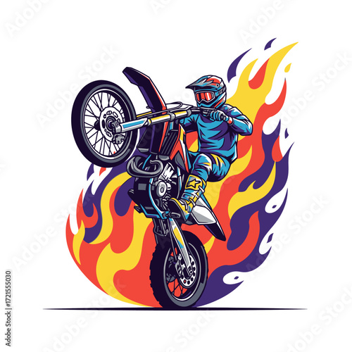 Motocross rider performing a wheelie with flames in the background.
