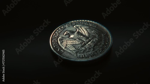 3D animation of a United States quarter dollar coin spinning on a dark surface and landing on tails, symbolizing chance, gambling and decision making.