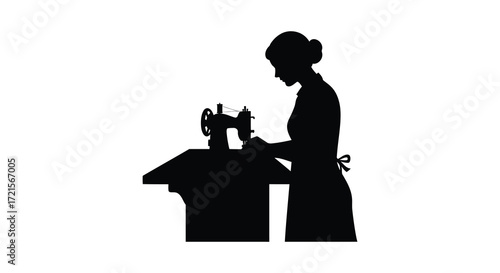 Silhouette of a woman operating a vintage sewing machine in darkness