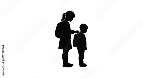 Two children silhouettes standing together one slightly taller than the other