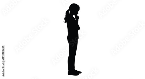 Silhouette of a young woman standing thoughtfully with hand to chin