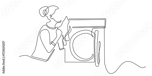 Continuous line drawing of a woman smelling freshly washed clothes from a washing machine.Suitable for laundry service concepts, household chores, clothing care, cleanliness and hygiene themes.