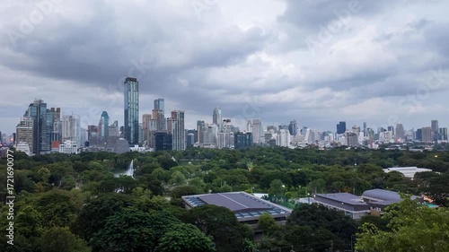 Dynamic Timelapse of Bustling Cityscape Vibrant Skyline with Skyscrapers, Lush Greenery, and Urban Park Under Dramatic Clouds Mesmerizing Blend of Nature and Urban Life