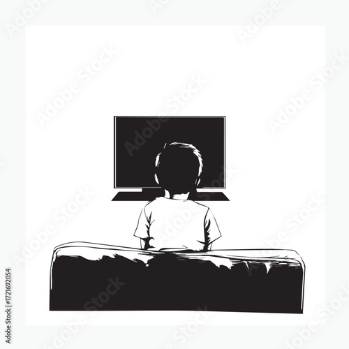 boy sitting on a chair watching tv