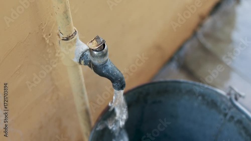 Water Filling Steel Bucket from Tap – Rural Scarcity