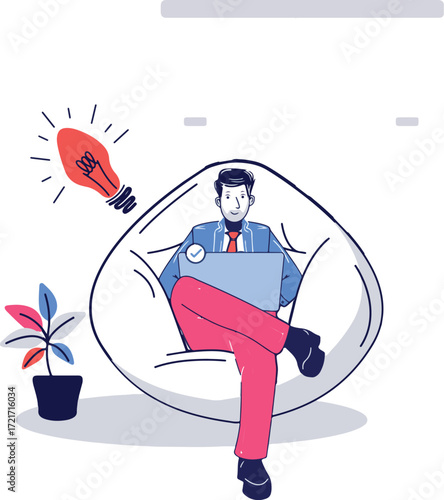 A person sits in a beanbag chair using a laptop with a lightbulb nearby