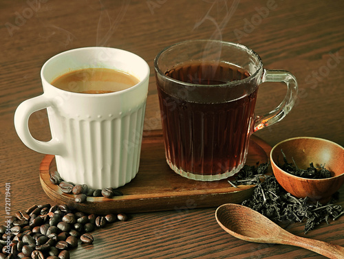 Hot coffee and hot tea on a wooden table