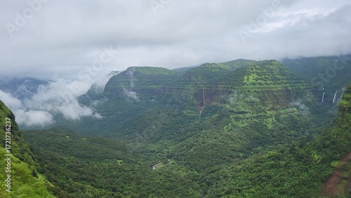 Panoramic landscape of the western ghats of India with clouds and multiple waterfalls, Varandha Ghat, Pune