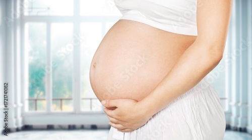 Free Download Young pregnant woman hold her belly - GFXLoad