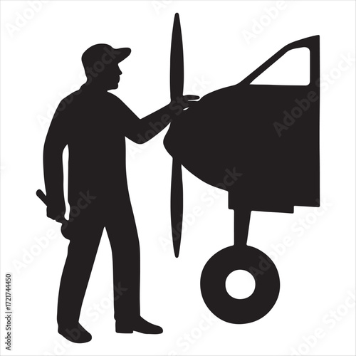 Silhouette of a mechanic inspecting a vintage airplane propeller and engine cowling with a wrench