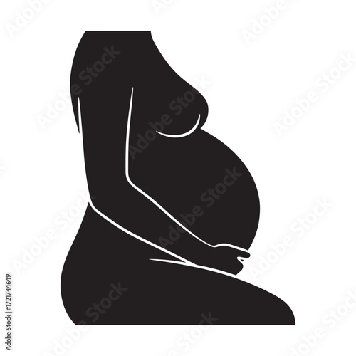 Silhouette of a pregnant woman embracing her belly, symbolizing pregnancy and motherhood
