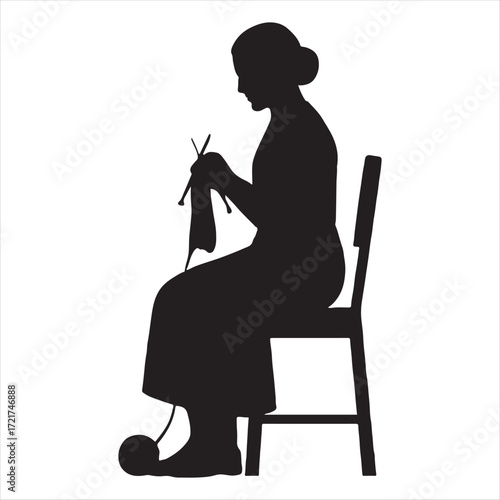 Silhouette of an elderly woman sitting on a chair knitting a garment with wool and needles