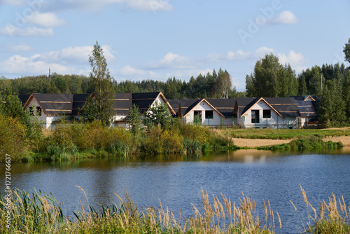 Breathtaking Scenic Lakeside View Featuring Modern Houses Nestled in Natures Embrace