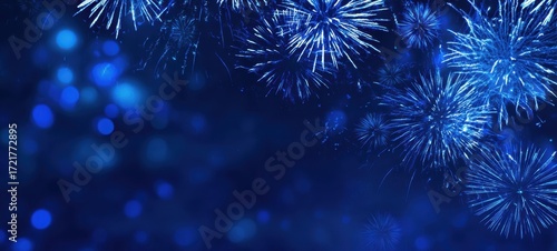 The vibrant blue fireworks illuminating the night sky in celebration.