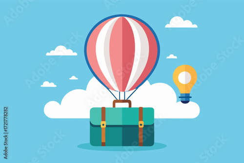 Colorful hot air balloon floating above a travel suitcase in a clear blue sky with clouds