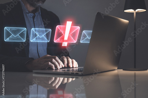 Cybersecurity concept: A businessman using a virtual interface to filter malicious spam and phishing emails