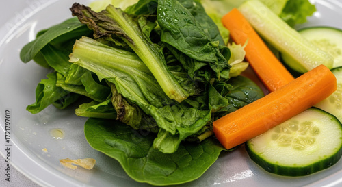 Good food waste management involves preparing fresh vegetable salad with carrot and cucumber healthy meal that helps reduce leftover food and promotes nutrition