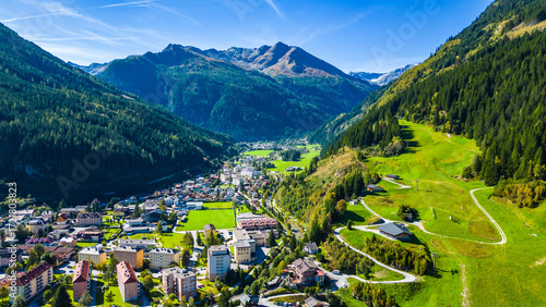 Aerial view scenic alpine town Bad Gastein in Austria with famous waterfall, ski lifts, spa hotels and wellness centers, combining nature, adventure, skiing and relaxation in the Salzburg Alps