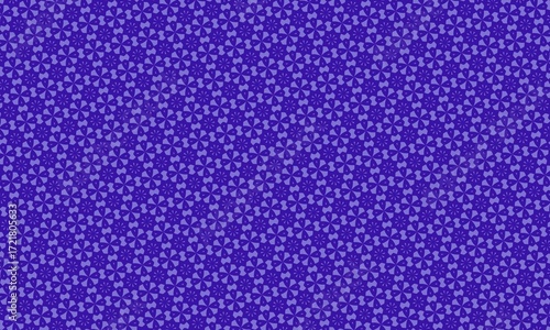 A dense pattern of stylized floral shapes in shades of purple creating a textured background effect