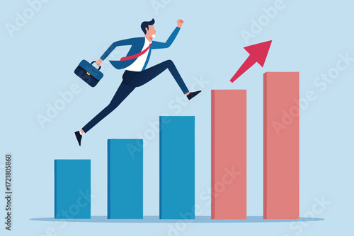 Businessman jumping over bar graphs showing growth in a modern office setting