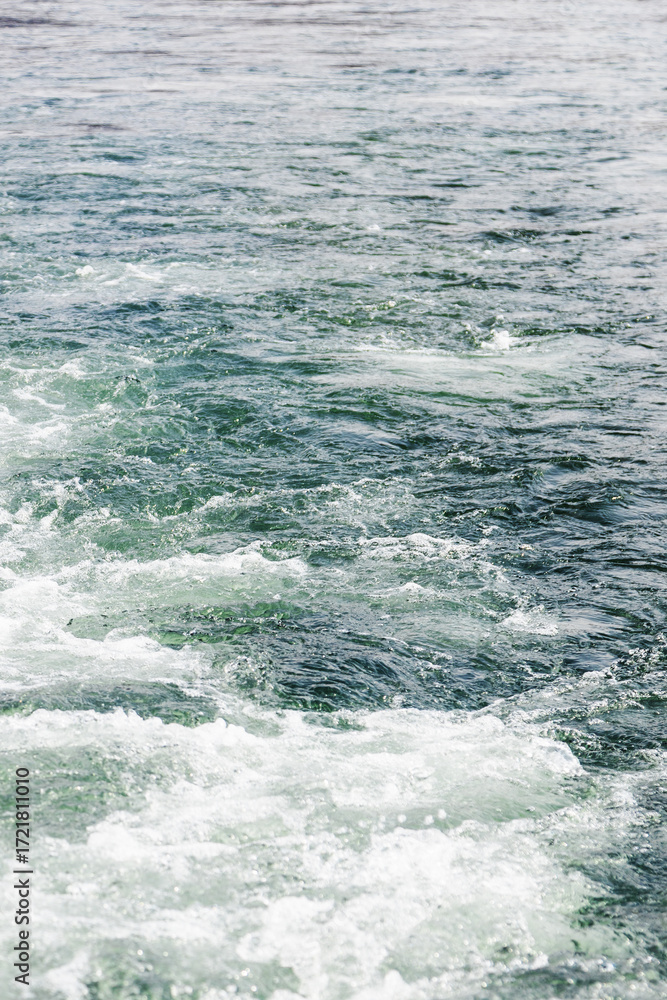 Obraz premium water churned up by boat propeller in Avacha bay