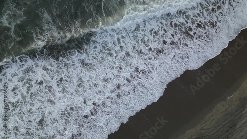 Directly above the crashing waves of the Pacific ocean shows the power and beauty of the ocean in 4k.