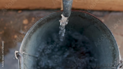 Water Filling Steel Bucket from Tap – Rural Scarcity