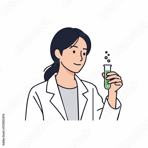 Female scientist in lab coat holding test tube