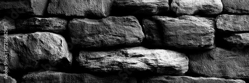 Textured stone wall in black and white captures rustic beauty