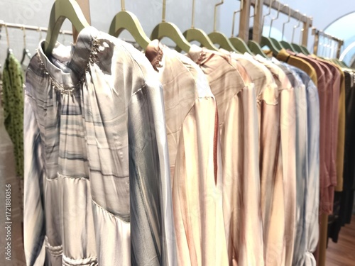 A collection of Muslim clothing for women with various designs, patterns and colors is sold in a clothing shop.