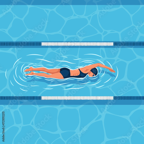 Woman swimming freestyle in a blue tiled swimming pool.