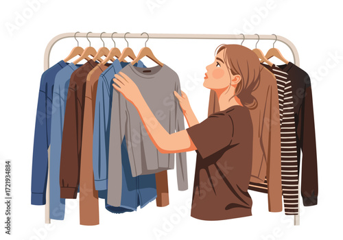 Young woman thoughtfully selecting clothes from a closet rack, embodying a modern and organized lifestyle