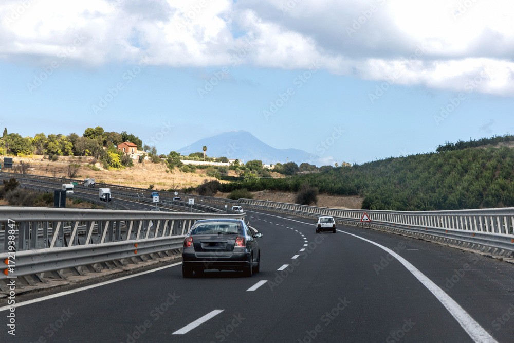Fototapeta premium Open road in Sicily with scenic mountain and bright sunny sky