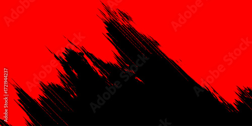Fiery sunset silhouette of wind-blown grass with abstract black trees against a sky of red and orange clouds