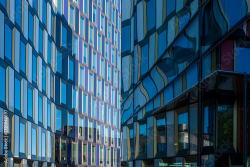 Glass façades of Stockholm office complex with vertical and horizontal rhythm, Scandinavian architecture reflecting clarity, perspective, geometry and modern design for visual creativity