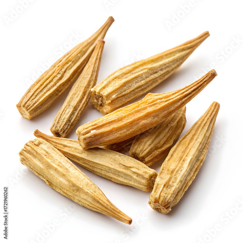 Dried drumstick vegetable pieces, also known as Moringa, isolated on a white background; commonly used