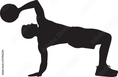 Silhouette of a fit athlete performing a dynamic exercise with a medicine ball indoors