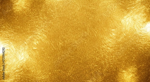 Abstract shimmering golden background with bright light effects