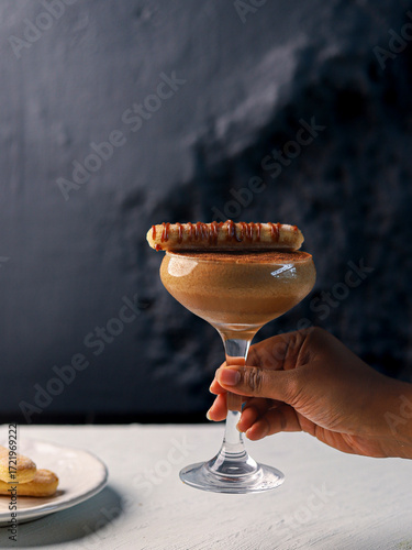 Elegant Tiramisu Inspired Cocktail with Wafer Garnish