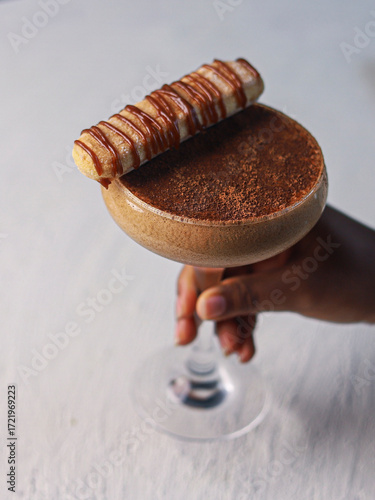 Elegant Tiramisu Inspired Cocktail with Wafer Garnish