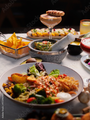 Latin Mexican Food on dining table with Multiple gourmet dishes