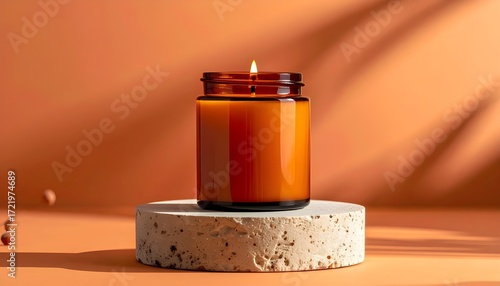 Amber apothecary jar candle staged on a neutral stone pedestal