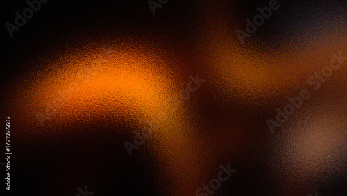 Abstract warm glowing orange and brown textured background with soft focus and bokeh effects