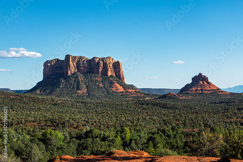 A gorgeous landscape view of the Courthouse and Bell Rock Formations under a blue sky. Yavapai County, Coconino County, Sedona, Village of Oak Creek, Arizona, USA.
