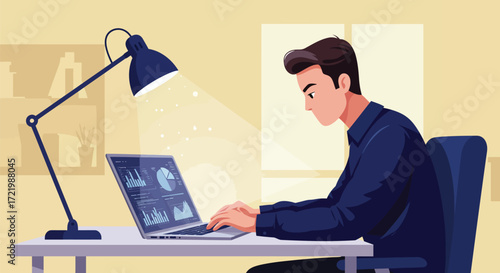 Dedicated young professional working late with laptop under focused lighting